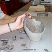 A large portion of a Roman funery pot found by R.C.Neville in the tumulus at Thriplow.